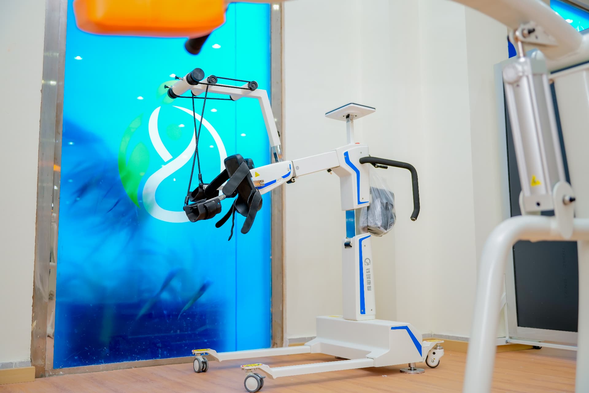 Supported walking rehabilitation equipment beside the Rayhan mark